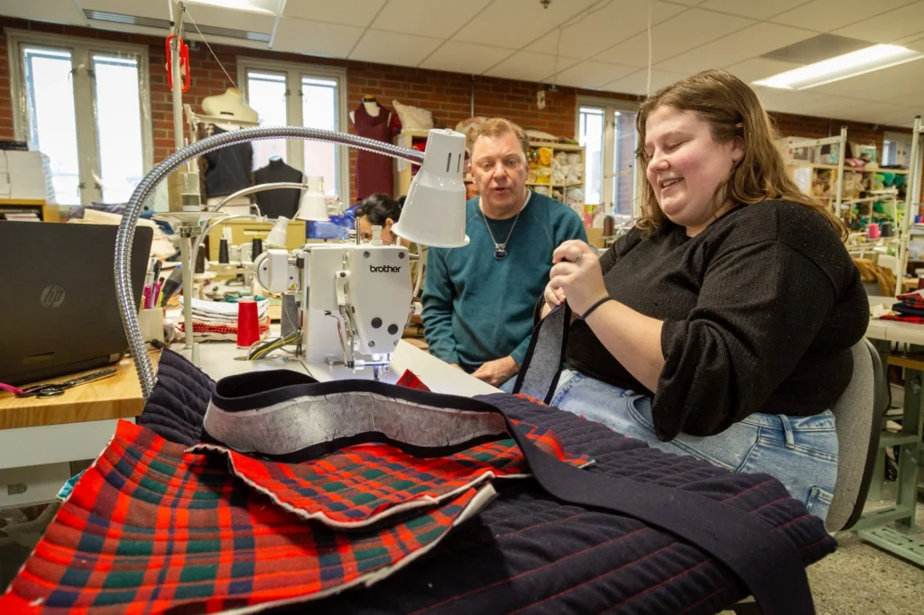 Gallery images show the interior of the sewing lab the story is featuring. Some images have people, some images are of the equipment within the studio, some images feature the owners, investors, and CEO of AltCap